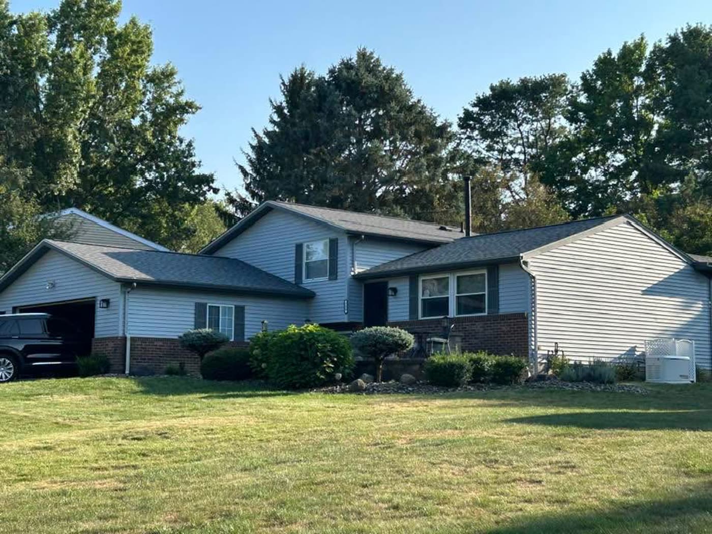 A split-level Northeast Ohio home with a new roof by Crest Roofing